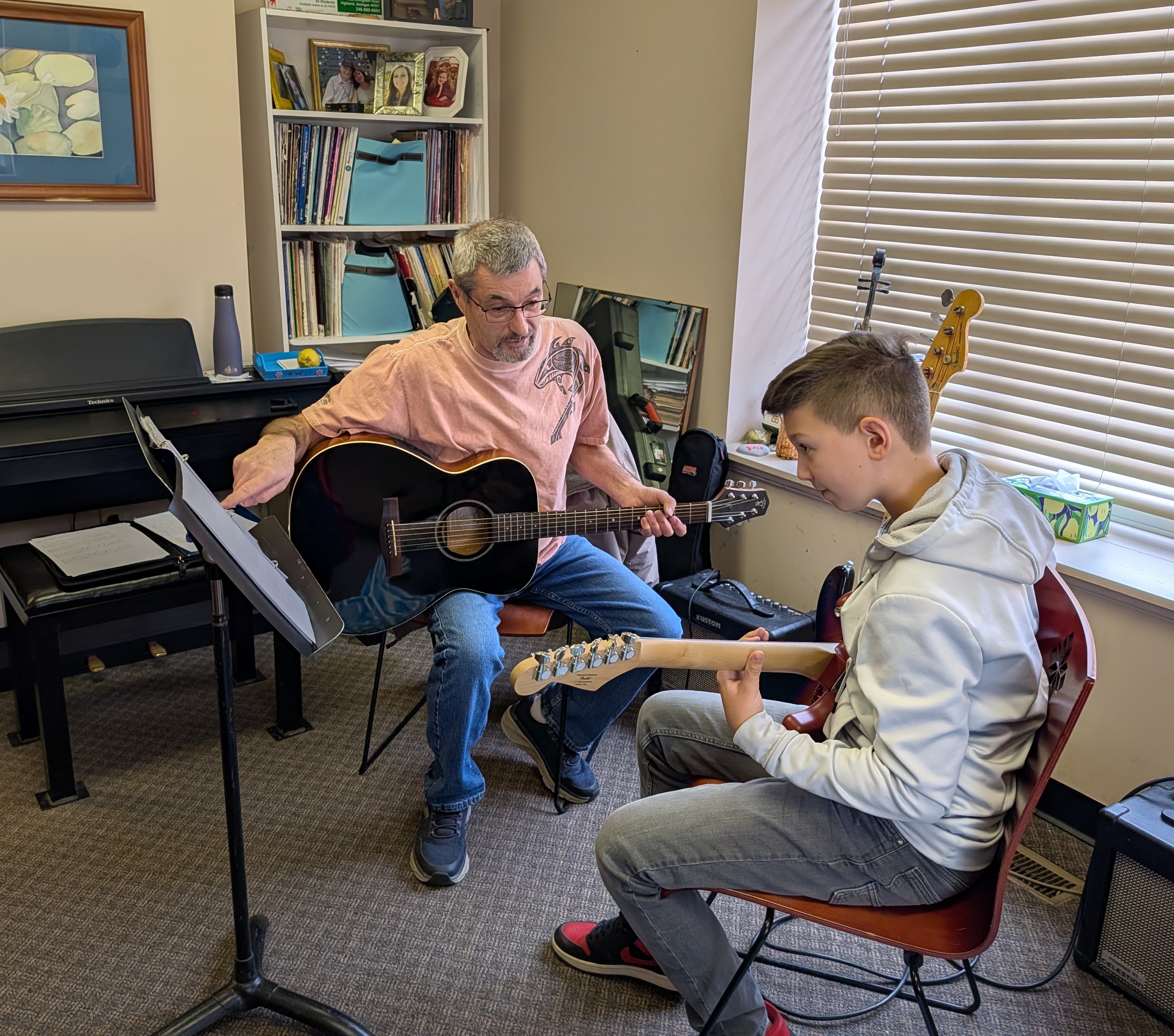 Student building consistency during weekly guitar lessons
